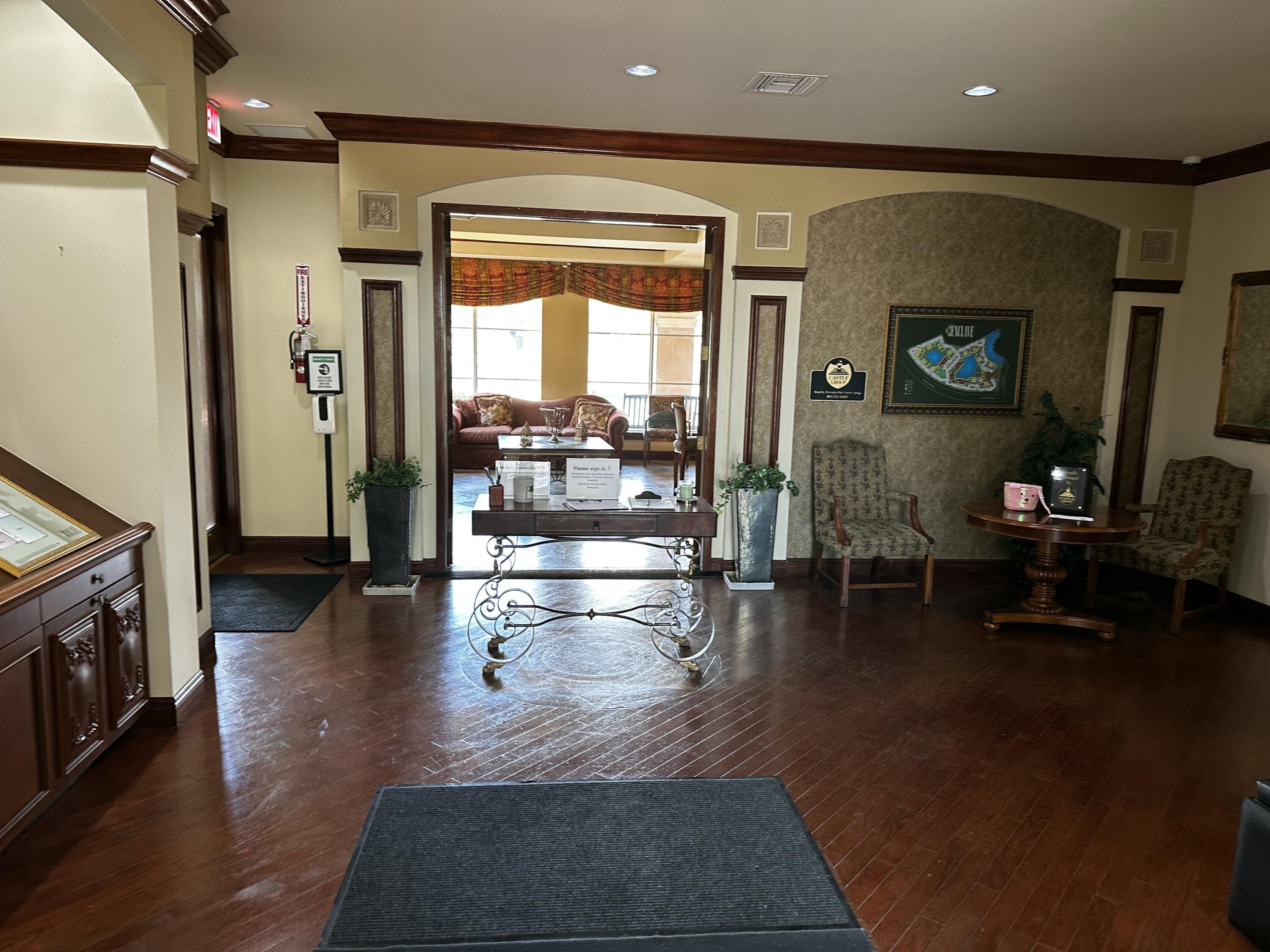 2103 Renaissance Boulevard, Unit 306 Miramar, FL 33025 - Photo 25 of 44 a lobby with furniture and wooden floor