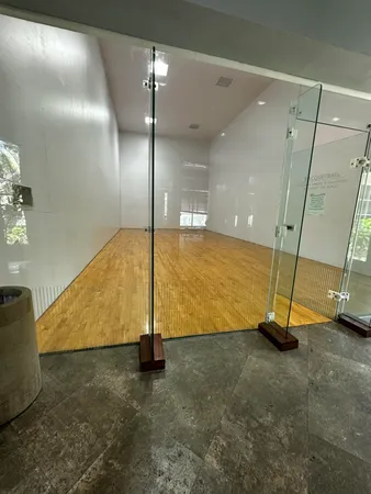 a view of a swimming pool with a table and chairs