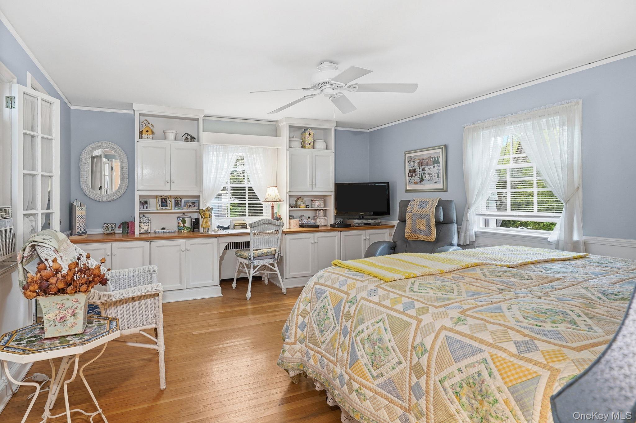 26 Cedarlawn Road Irvington, NY 10533 - Photo 17 of 34 a bed room with a bed and a television