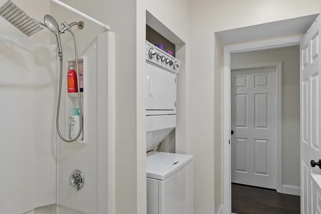 a bathroom with a shower and a sink