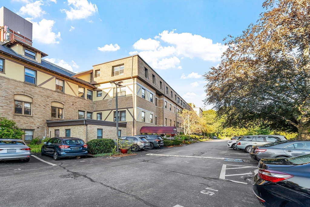 1029 Pleasant Street, Unit 19 Worcester, MA 01602 - Photo 2 of 23 a view of a street with cars