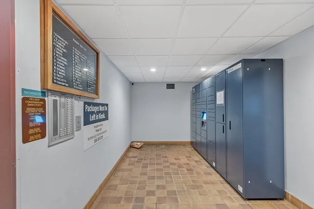 a hallway with wooden floor in a hall with front door