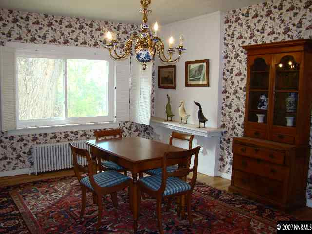 3370 Johnson Lane Reno, NV 89511 - Photo 2 of 5 a view of a dining room with furniture and chandelier