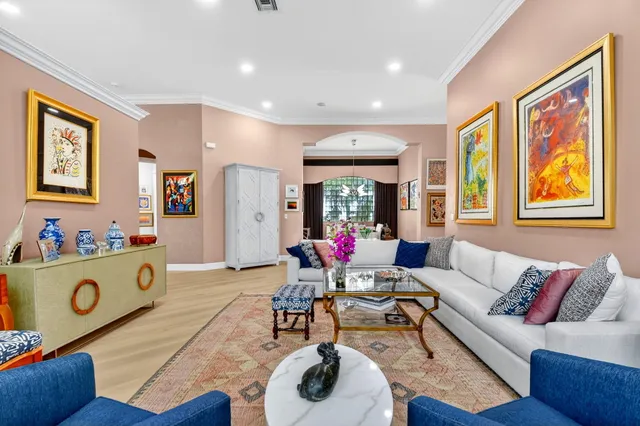 a view of a dining room with furniture large windows and wooden floor