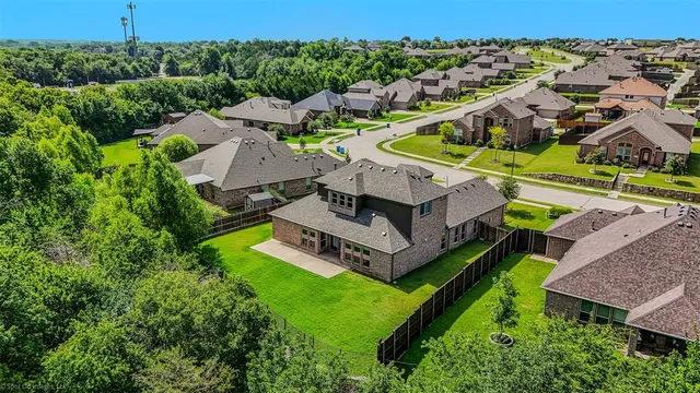 an aerial view of a house with a garden