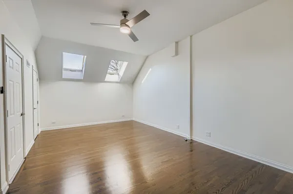 a spacious bathroom with a double vanity sink and a mirror