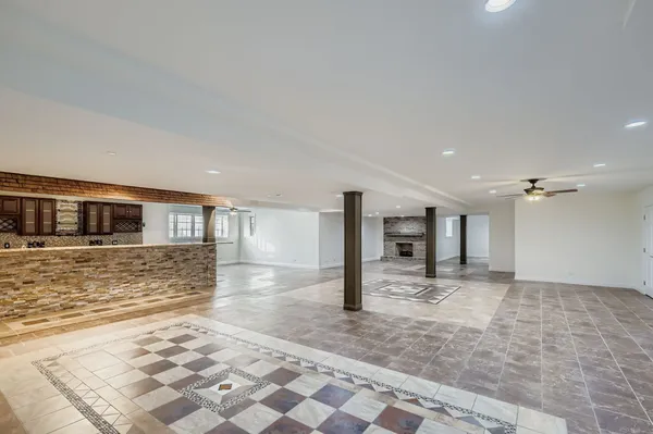 a kitchen with stainless steel appliances granite countertop a stove sink and cabinets