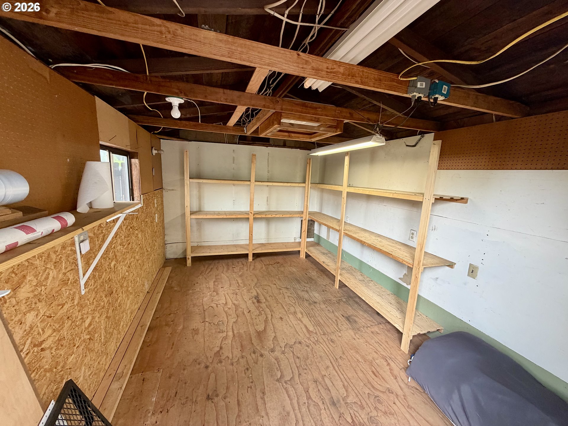 24950 Airport Road Northeast Aurora, OR 97002 - Photo 42 of 44 a view of an empty room with wooden floor