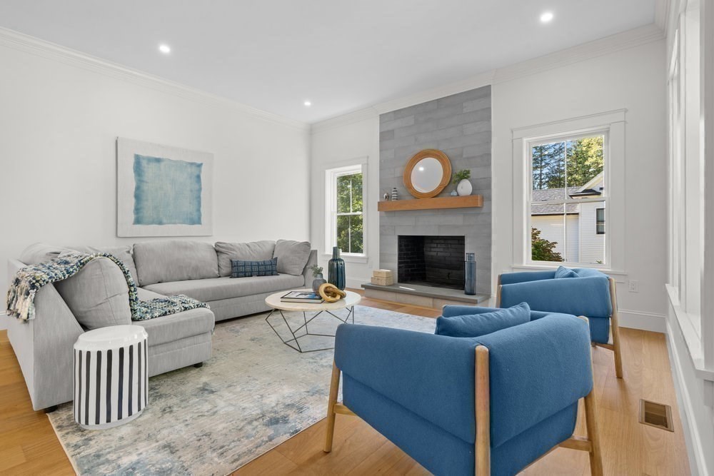 22 Tyler Road Lexington, MA 02420 - Photo 16 of 37 a living room with furniture and a fireplace