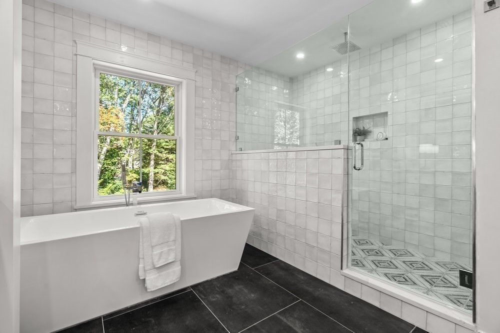 22 Tyler Road Lexington, MA 02420 - Photo 27 of 37 a bathroom with a bathtub and shower