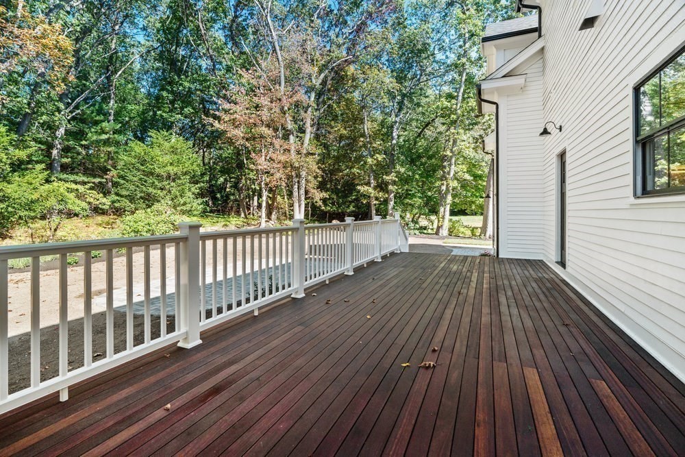 22 Tyler Road Lexington, MA 02420 - Photo 35 of 37 a view of deck with wooden floor and fence