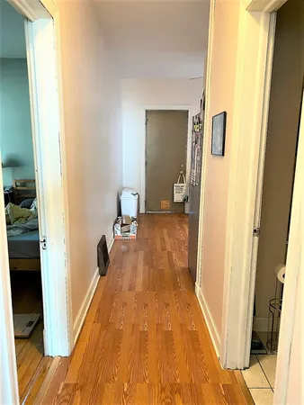 a view of a bedroom from a hallway