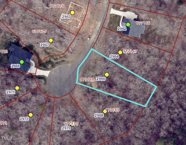 a living room with furniture and plants