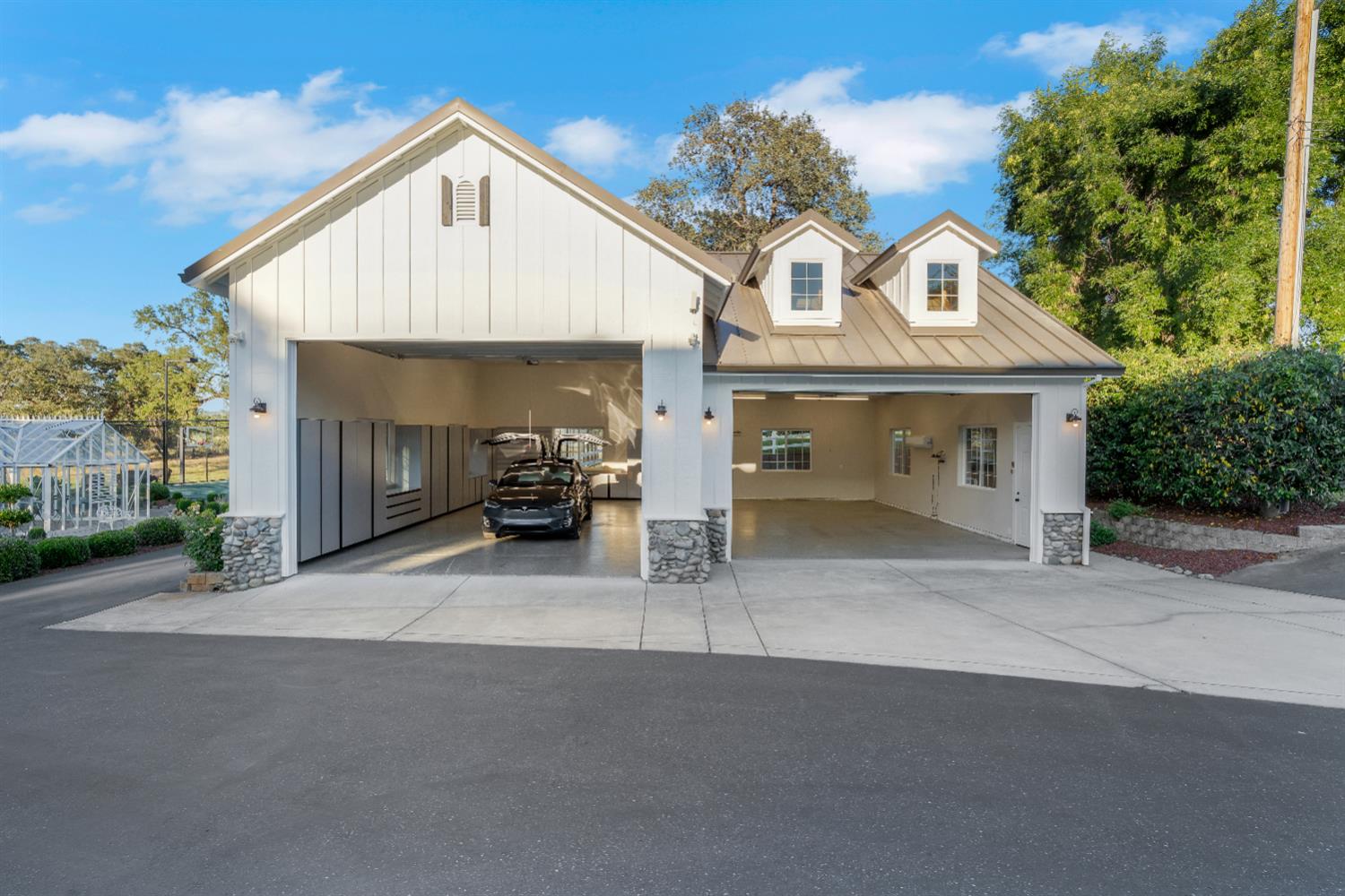 2905 Virginiatown Road Lincoln, CA 95648 - Photo 67 of 86 Spacious multi-bay garage with vertical siding and stone column accents