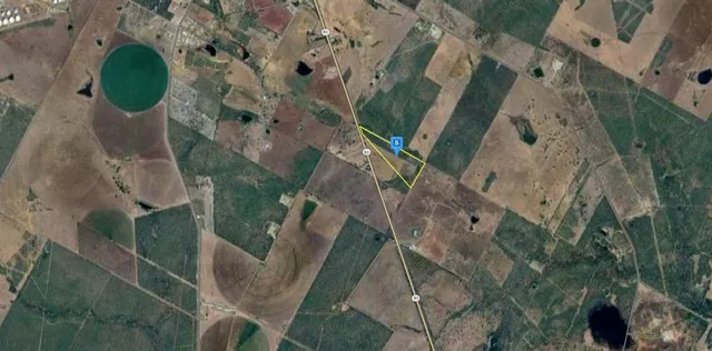 an aerial view of a house with outdoor space