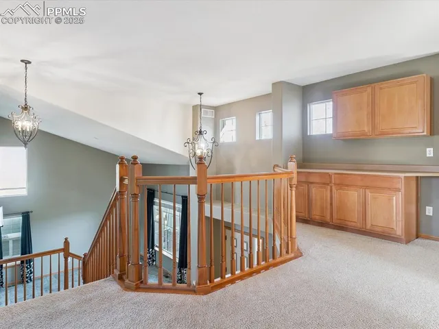 a bedroom with a large bed couch and a window