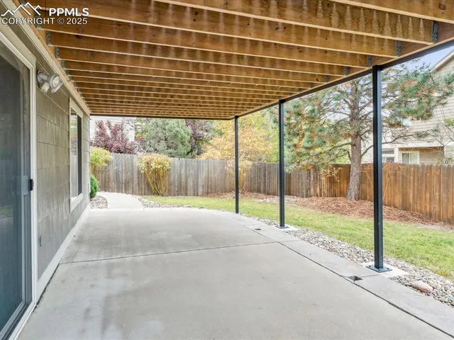 a view of a two chairs on the roof deck
