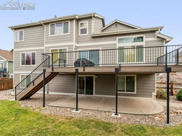 a view of a glass door with a tree