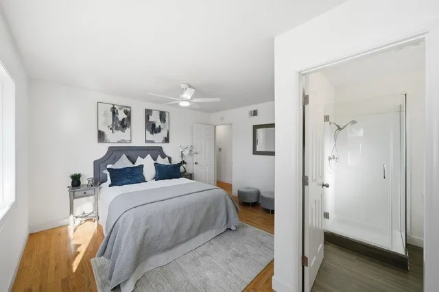 a bedroom with a bed and a view of bathroom