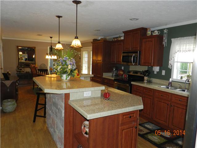 2407 Sylvia Road Dickson, TN 37055 - Photo 2 of 19 You will love the flow in this house. Kitchen is open to dining area and living room.
