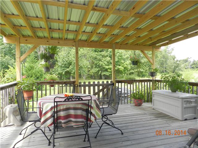 2407 Sylvia Road Dickson, TN 37055 - Photo 13 of 19 Covered Back Deck off the Dining Room. Great for family cook outs or just enjoy the nature and relax.