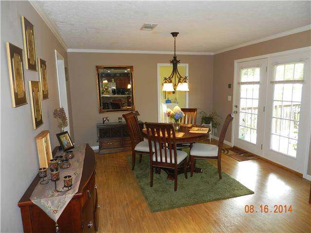 2407 Sylvia Road Dickson, TN 37055 - Photo 4 of 19 Dining Room Open to the Kitchen. Door to the covered back deck.