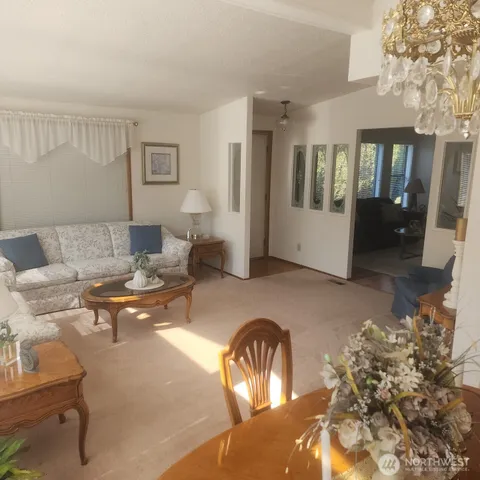a kitchen with a sink a window and cabinets