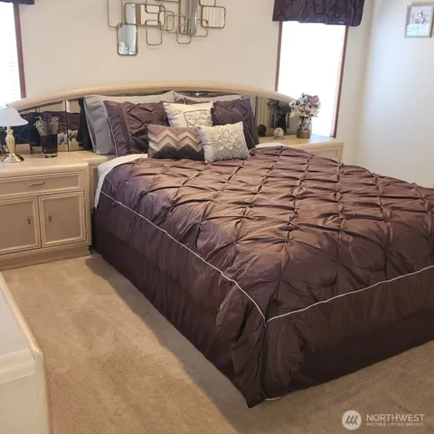 a bathroom with a bathtub and mirror