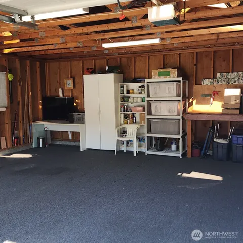 an aerial view of residential houses with outdoor space and parking
