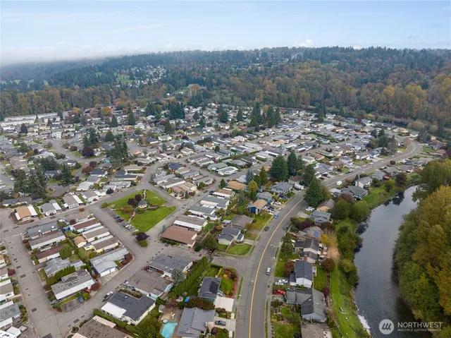 a view of a house with outdoor space and sitting area