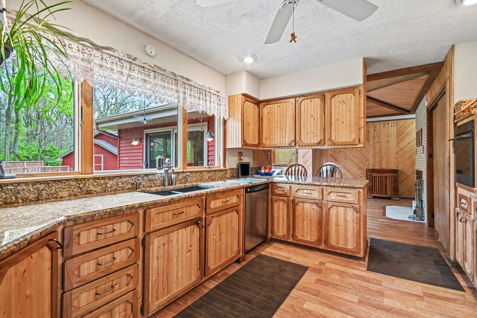 14340 West Bruce Road Homer Glen, IL 60491 - Photo 11 of 38 a open kitchen with stainless steel appliances granite countertop a sink and cabinets with wooden floor