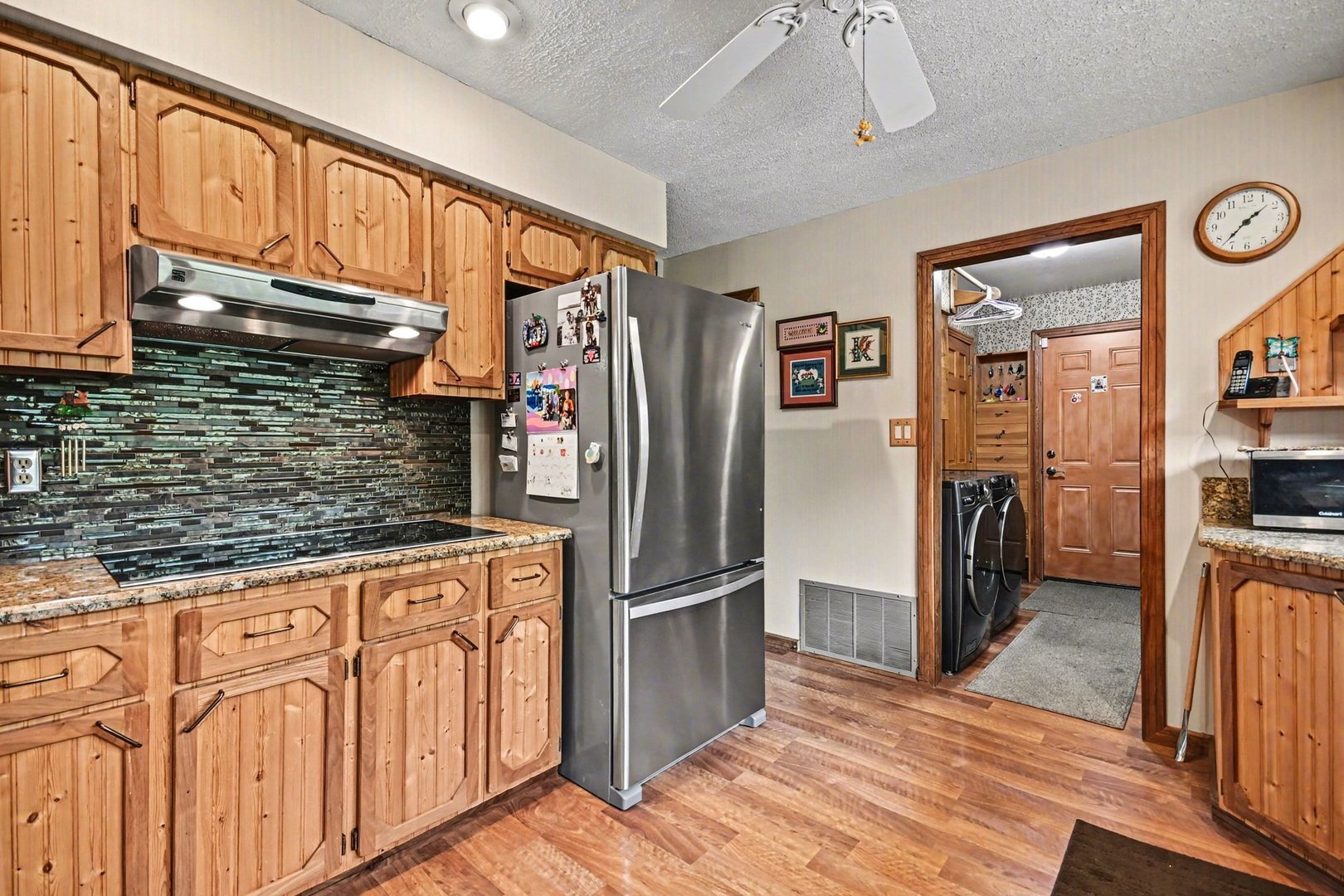 14340 West Bruce Road Homer Glen, IL 60491 - Photo 13 of 38 a kitchen with stainless steel appliances granite countertop a refrigerator a stove and a sink with cabinets
