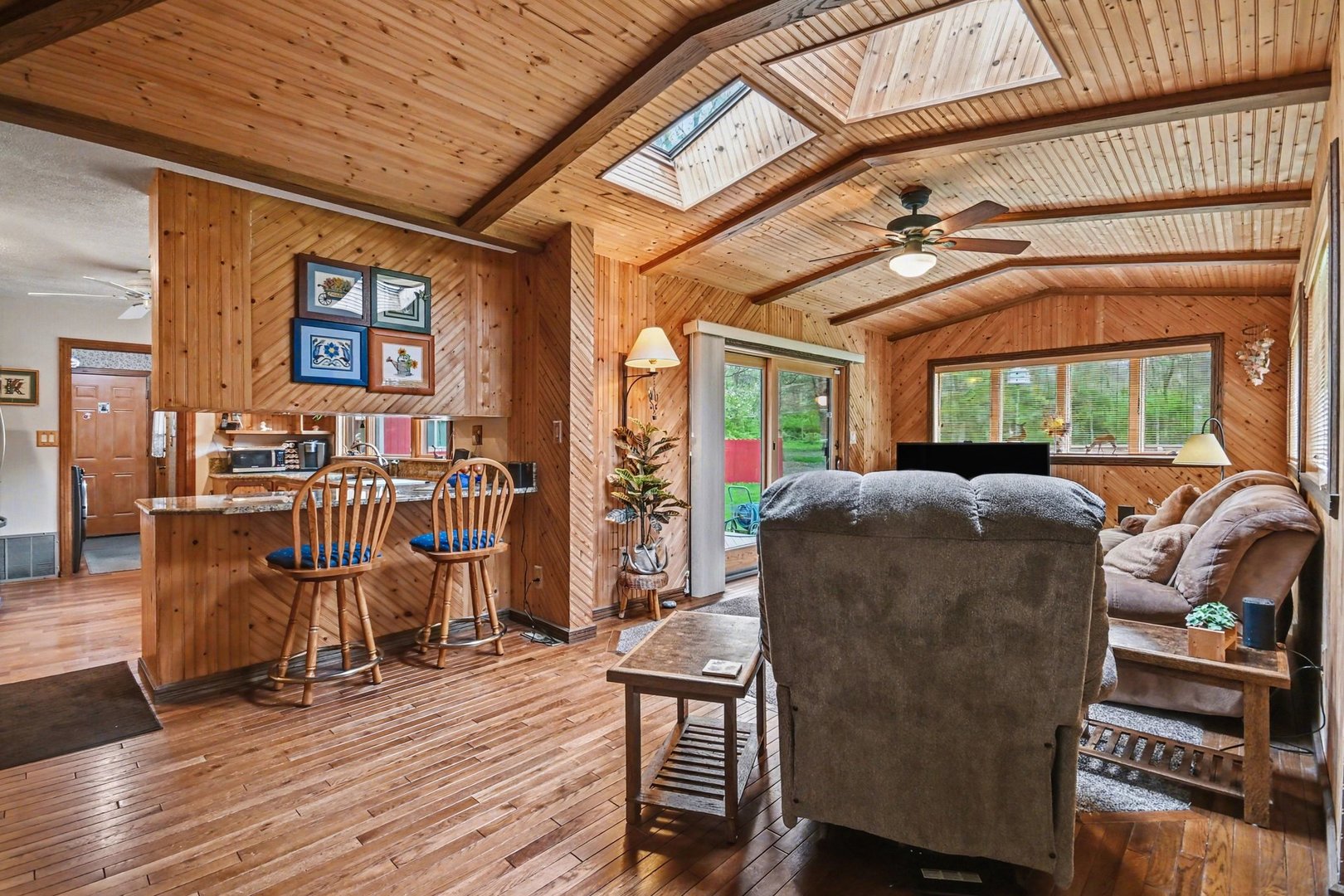 14340 West Bruce Road Homer Glen, IL 60491 - Photo 15 of 38 a living room with furniture a wooden floor and next to a window