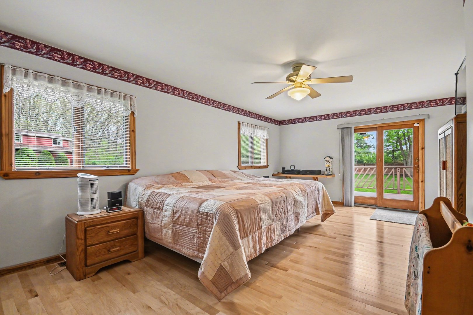14340 West Bruce Road Homer Glen, IL 60491 - Photo 17 of 38 a spacious bedroom with a bed and a chandelier