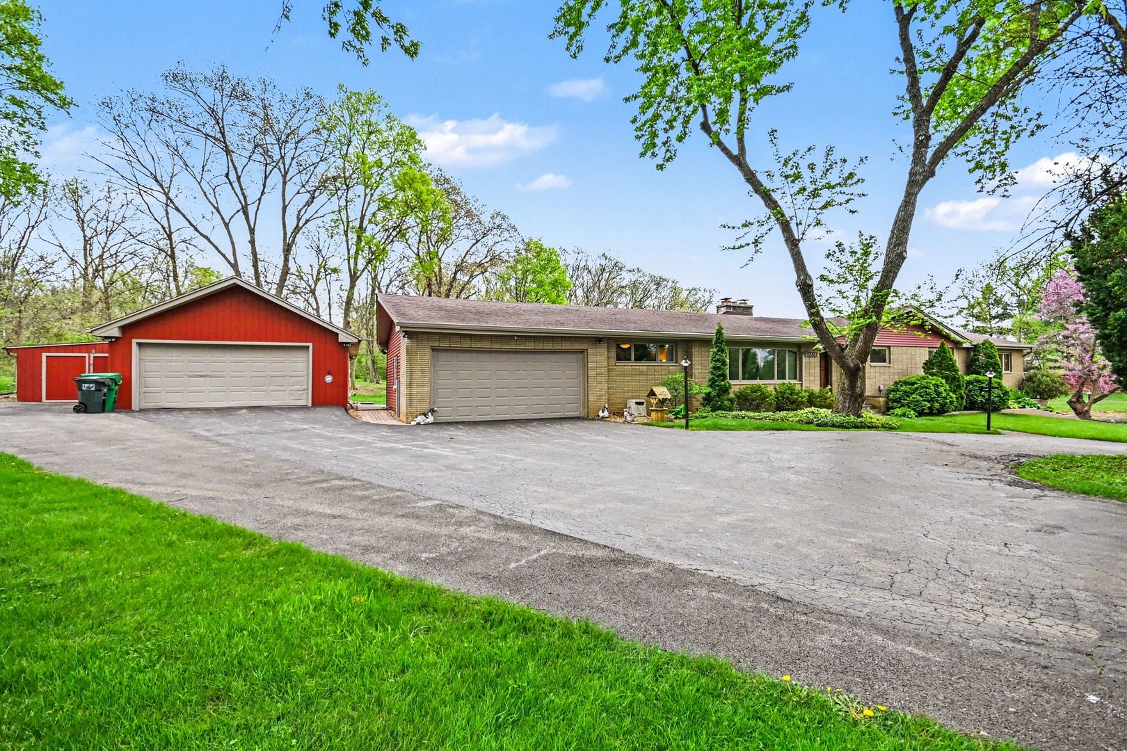 14340 West Bruce Road Homer Glen, IL 60491 - Photo 3 of 38 a front view of a house with a yard and garage