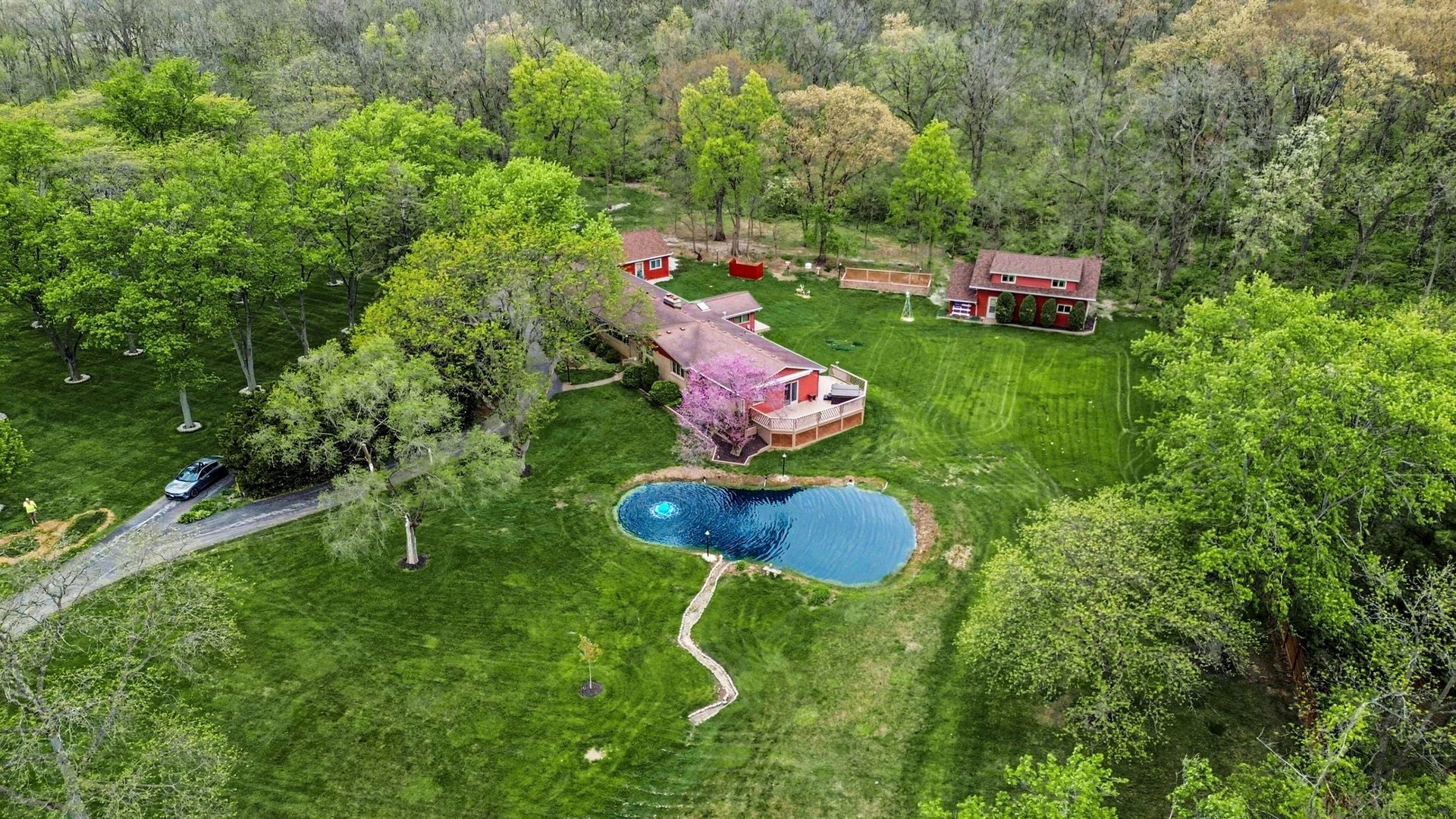 14340 West Bruce Road Homer Glen, IL 60491 - Photo 4 of 38 a backyard of a house with table and chairs a fire pit