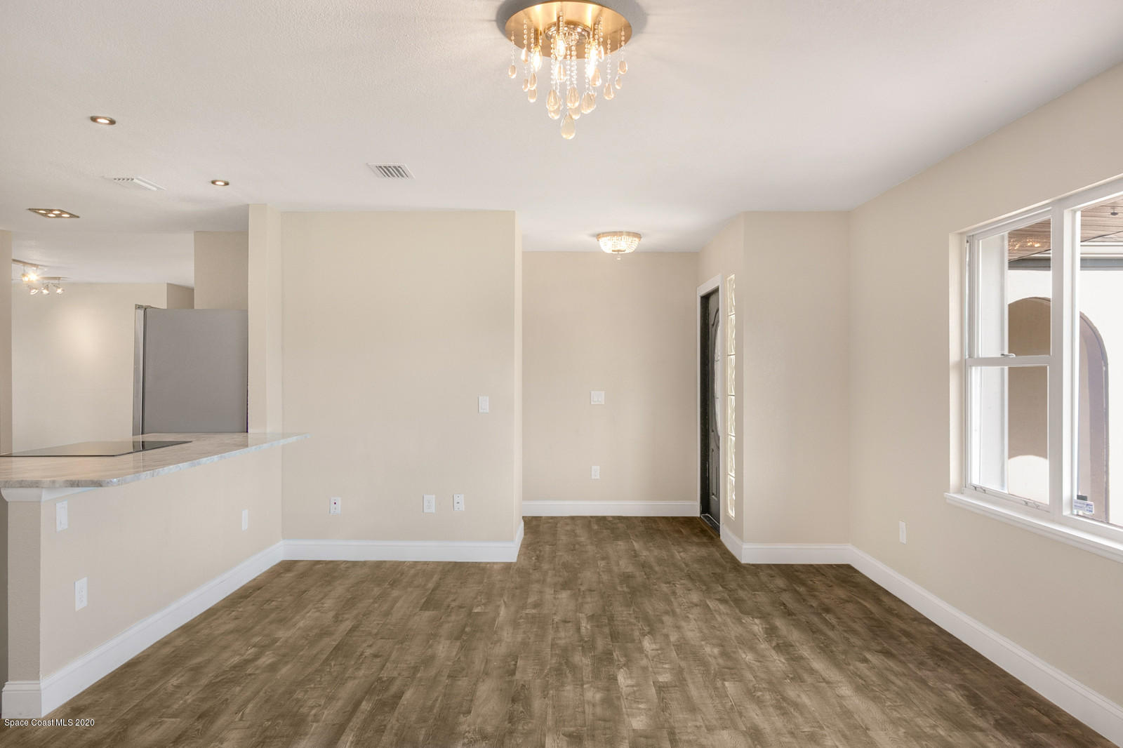 1058 Cromey Road Northeast Palm Bay, FL 32905 - Photo 19 of 29 Living/Dining Room