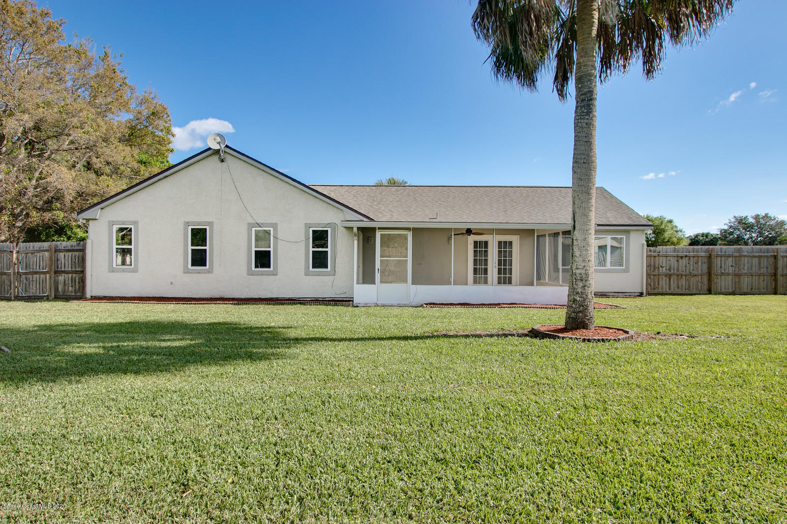 1058 Cromey Road Northeast Palm Bay, FL 32905 - Photo 25 of 29 Back view of house