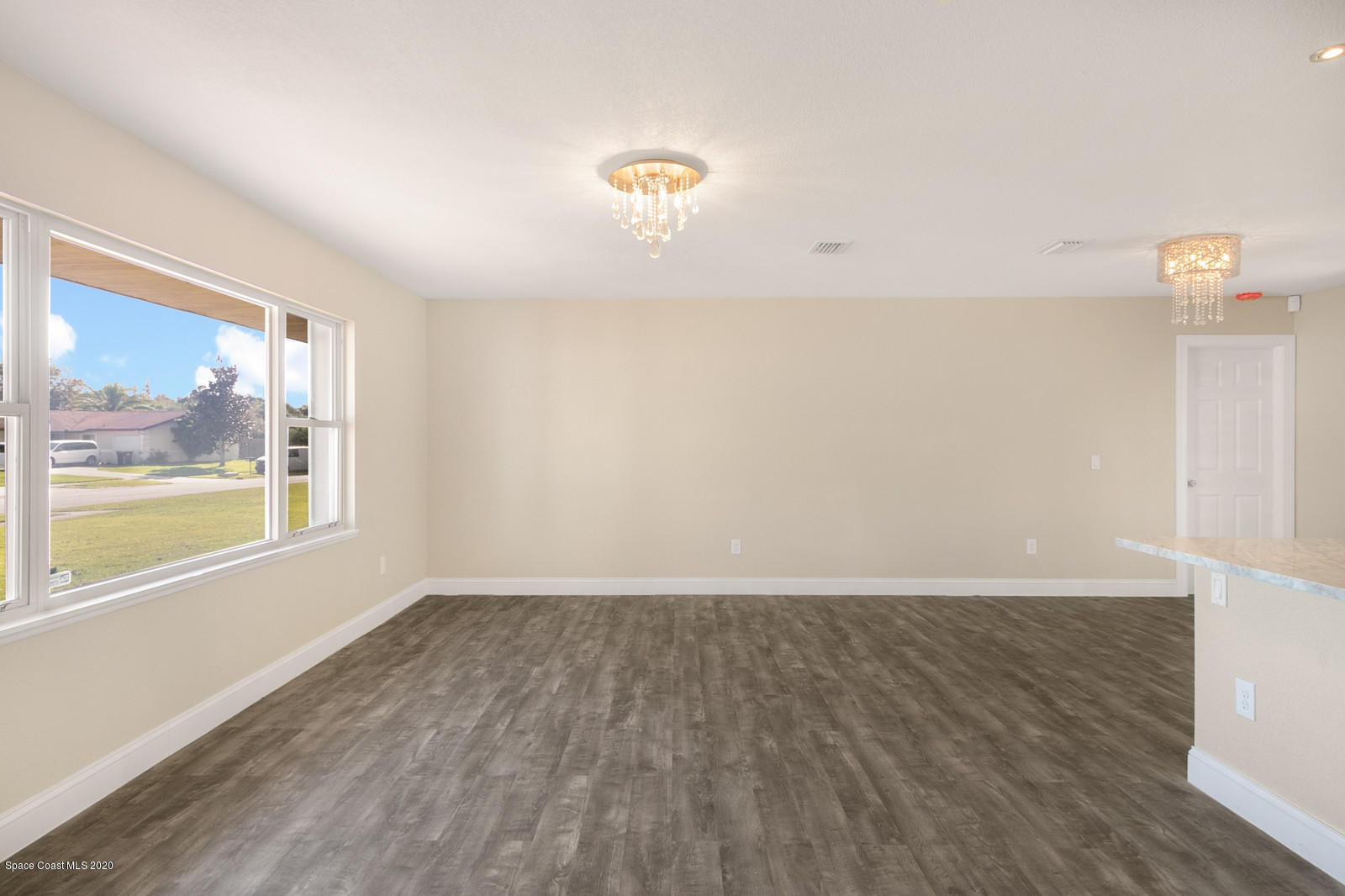 1058 Cromey Road Northeast Palm Bay, FL 32905 - Photo 4 of 29 Living/Dining Room