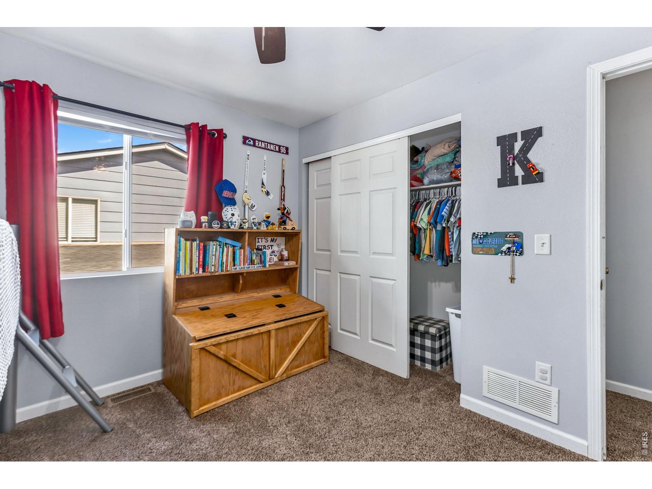 233 East 19th Street Road Greeley, CO 80631 - Photo 13 of 22 a living room with furniture and a window