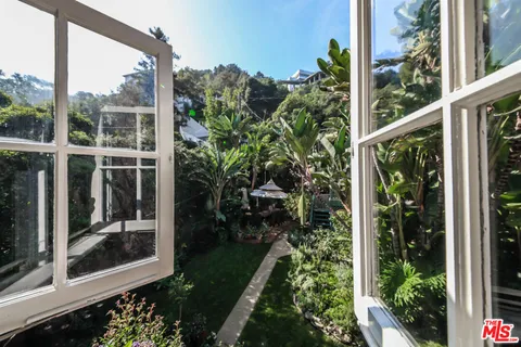 a view of a balcony with a garden