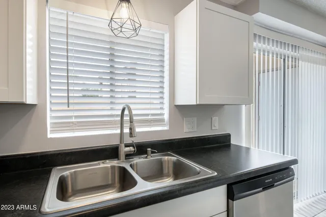 a kitchen that has a sink and a window