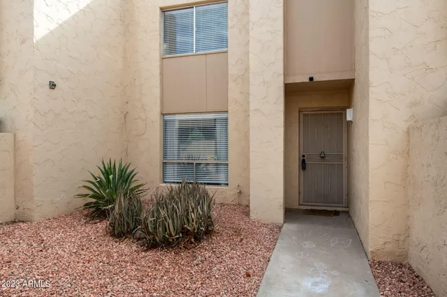 a view of entryway with wooden floor and a potted plant