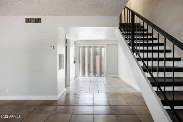 a view of entryway with a front door