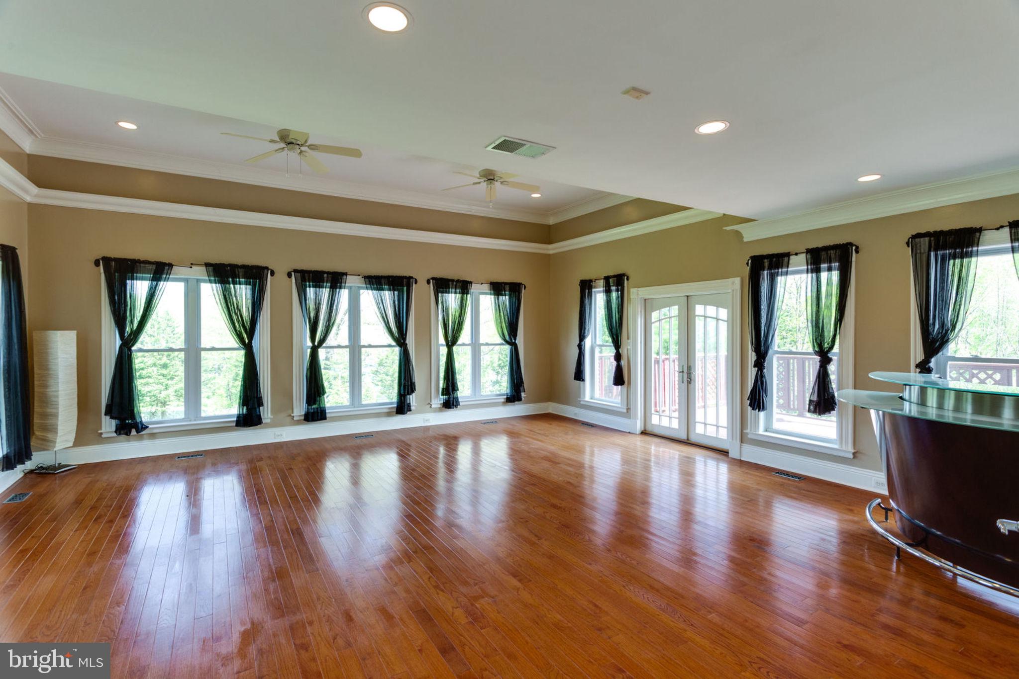 12821 Travilah Road Potomac, MD 20854 - Photo 13 of 59 Expansive sunroom for entertaining