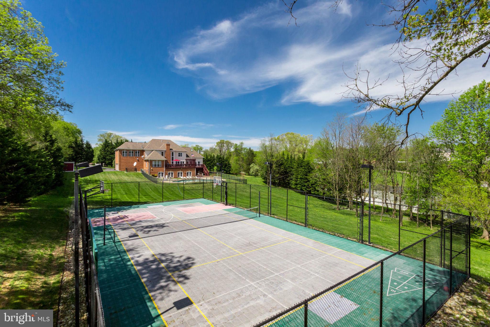 12821 Travilah Road Potomac, MD 20854 - Photo 40 of 59 Basketball/Tennis Court with lights