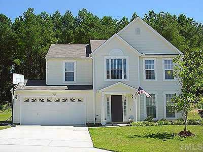 5112 Cardinal Grove Boulevard Raleigh, NC 27616 - Photo 1 of 1 a front view of a house with a yard
