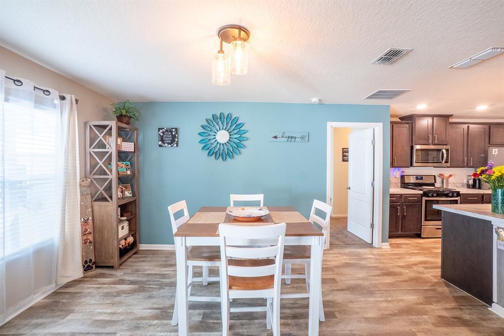 15 Grand Par Court Bunnell, FL 32110 - Photo 19 of 61 a dining room with furniture and kitchen view