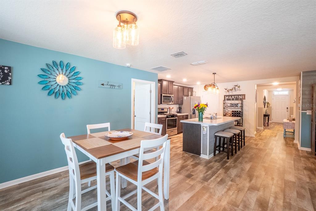 15 Grand Par Court Bunnell, FL 32110 - Photo 20 of 61 a view of a dining room with furniture and a chandelier
