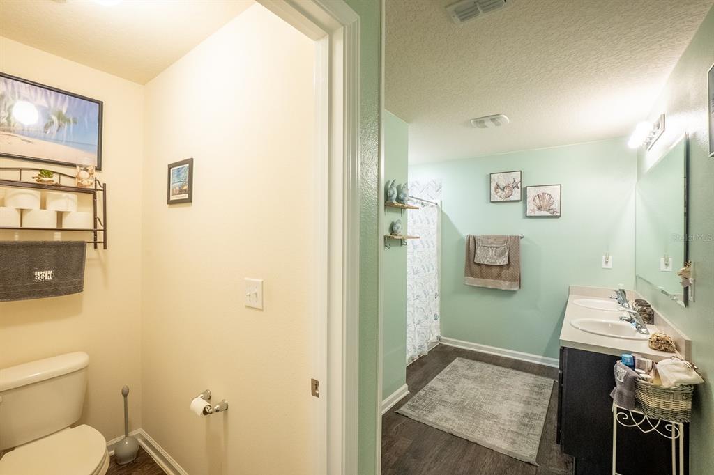 15 Grand Par Court Bunnell, FL 32110 - Photo 29 of 61 a bathroom with a granite countertop sink a toilet and shower